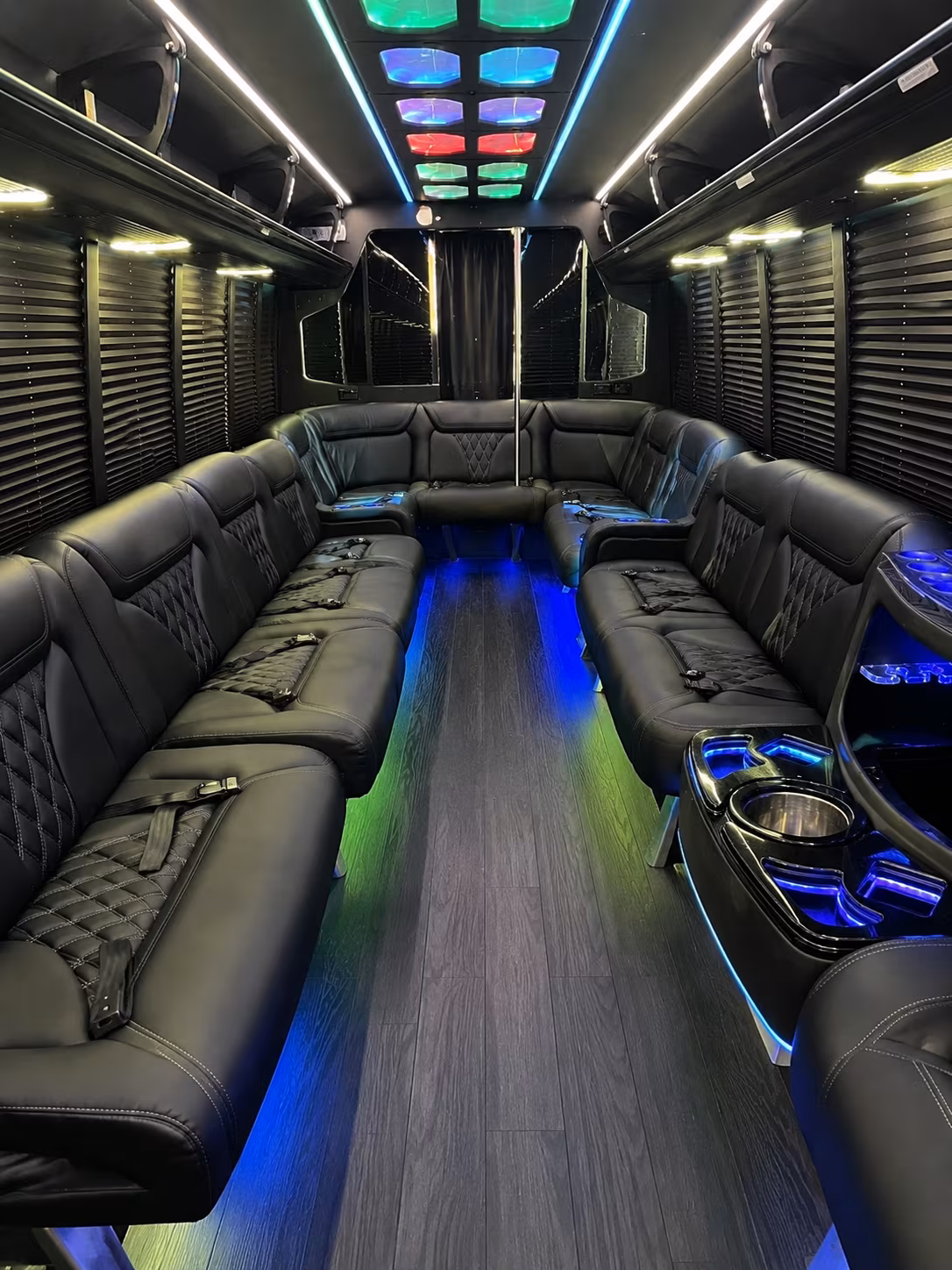 Friends laughing during a party bus celebration in Laredo